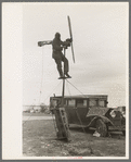 Shrimp fisherman, squatter on Nueces Bay, erecting wind charger for running his radio. Corpus Christi, Texas