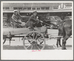 Farmer and daughter in wagon, Saturday afternoon, San Augustine, Texas