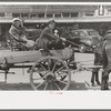 Farmer and daughter in wagon, Saturday afternoon, San Augustine, Texas