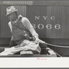 Negro strawberry farmer on top of wagon in front of refrigerator car, Hammond, Louisiana