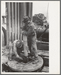 Guiding bit through rotary table, oil well, Kilgore, Texas