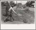 Negro mowing lawn, San Augustine, Texas