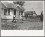 Negro mowing lawn, San Augustine, Texas