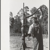 FSA (Farm Security Administration) client pumping water from his sanitary well, Sabine Farms, Marshall, Texas