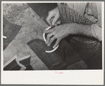 Fitting beading to upper of boot in bootmaking shop. Alpine, Texas