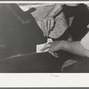 Cutting out heel of the upper from piece of leather. Bootmaking shop, Alpine, Texas