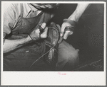 Sewing foot of boot onto sole of Goodyear welt system. Cowboy boot shop, Alpine, Texas