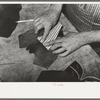 Putting piece of canvas into foot of boot. This is the only piece of cloth in the boots and holds the wrinkles and toe flower. Cowboy boot shop, Alpine, Texas