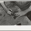 Trimming lower part of boot. Cowboy bootmaking shop, Alpine, Texas