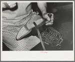 Attaching piece of leather in arch of sole by means of wooden pegs. Cowboy bootmaking shop, Alpine, Texas