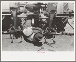 Adjusting plow points on tractor-drawn planter, large farm near Ralls