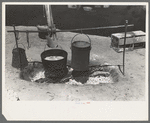 Dinner cooking over an open fire. Cattle ranch near Spur, Texas