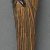 Green umbrella with a parrot-headed handle, like that carried by Mary Poppins