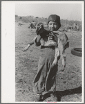 Mexican boy with goat, Crystal City, Texas