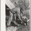 Mexican land grubber in front of his camp, El Indio, Texas