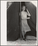 Daughter of migrant strawberry picker in doorway of tent home near Hammond, Louisiana