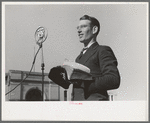 Itinerant preacher broadcasting to his audience by means of public address system on streets of Marshall, Texas