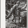 Young boy packing shingles at small mill near Jefferson, Texas