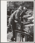 Young boy packing shingles at small mill near Jefferson, Texas