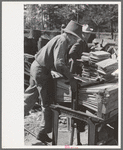 Young boy packing shingles at small mill near Jefferson, Texas