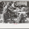 Young boy packing shingles at small mill near Jefferson, Texas