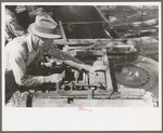 Sawing shingles by means of horizontal circular saw at small mill near Jefferson, Texas