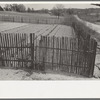 Garden enclosed by picket fence to keep out rabbits, pigs, dogs, chickens, etc. near Marshall, Texas