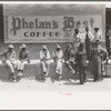 Farmers sitting on curb, San Augustine, Texas