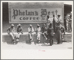 Farmers sitting on curb, San Augustine, Texas