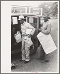 Negro farmer with supplies and freshly pressed suit, Saturday afternoon, San Augustine, Texas