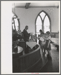 Preacher reading the lesson and instructions before baptism, San Augustine, Texas