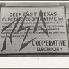 Sign illustrating electric cooperative, San Augustine, Texas
