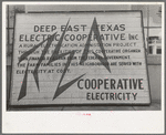 Sign illustrating electric cooperative, San Augustine, Texas