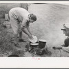 Making lunch along the roadside, near Henrietta, Oklahoma. This is a migrant family en route to California