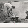 Making lunch along the roadside, near Henrietta, Oklahoma. This is a migrant family en route to California