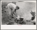 Making lunch along the roadside, near Henrietta, Oklahoma. This is a migrant family en route to California