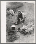 Making lunch along the roadside near Henrietta, Oklahoma. This is a migrant family en route to California