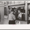 Tobacco dealer waiting on motorman at streetcar terminal, Oklahoma City, Oklahoma