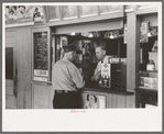 Tobacco dealer waiting on motorman at streetcar terminal, Oklahoma City, Oklahoma