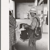 Postman with equipment waiting to board. Streetcar terminal, Oklahoma City, Oklahoma