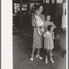 Mother with children trying to locate the streetcar they want to catch. Streetcar terminal, Oklahoma City, Oklahoma