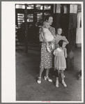 Mother with children trying to locate the streetcar they want to catch. Streetcar terminal, Oklahoma City, Oklahoma