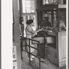 Woman buying ticket at gate. Streetcar terminal, Oklahoma City, Oklahoma