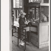 Woman buying ticket at gate. Streetcar terminal, Oklahoma City, Oklahoma