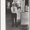 Man with luggage waiting for streetcar. Terminal, Oklahoma City, Oklahoma