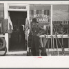 Man in front of secondhand store, Muskogee, Oklahoma