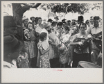 Group of people assembled under tree to listen to revival rally on Saturday afternoon, Tahlequah, Oklahoma