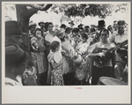 Group of people assembled under tree to listen to revival rally on Saturday afternoon, Tahlequah, Oklahoma
