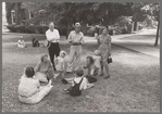 Group of people sitting in square in front of courthouse, Tahlequah, Oklahoma