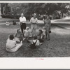 Group of people sitting in square in front of courthouse, Tahlequah, Oklahoma